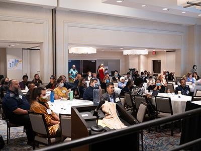 A crowded conference room. 