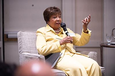 The Honorable Eddie Bernice Johnson speaks from the dais of a conference. 